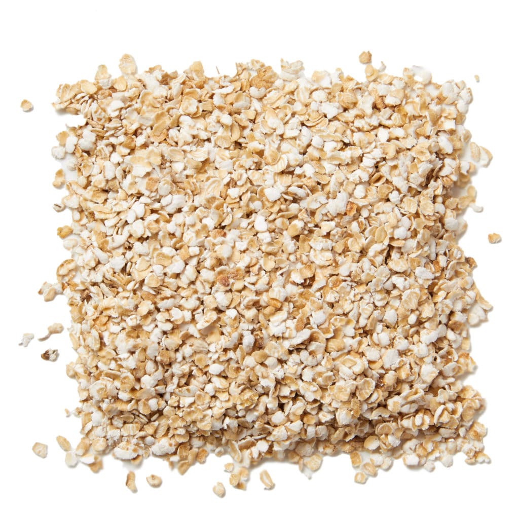 A pile of organic baby rolled oats from a birds-eye view.